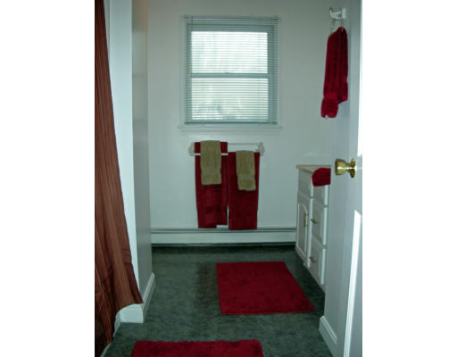 63 Long Pond Road Tyngsborough, MA 01879 - Photo 9 of 16 a living room with furniture and a window