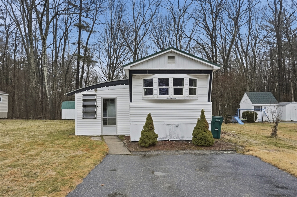 17 Conestoga Trail Brookfield, MA 01506 - Photo 1 of 20 a front view of a house with a yard and garage