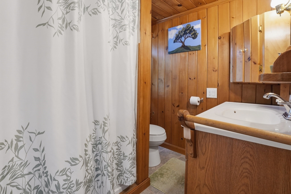 17 Conestoga Trail Brookfield, MA 01506 - Photo 15 of 20 a bathroom with a sink and mirror with toilet
