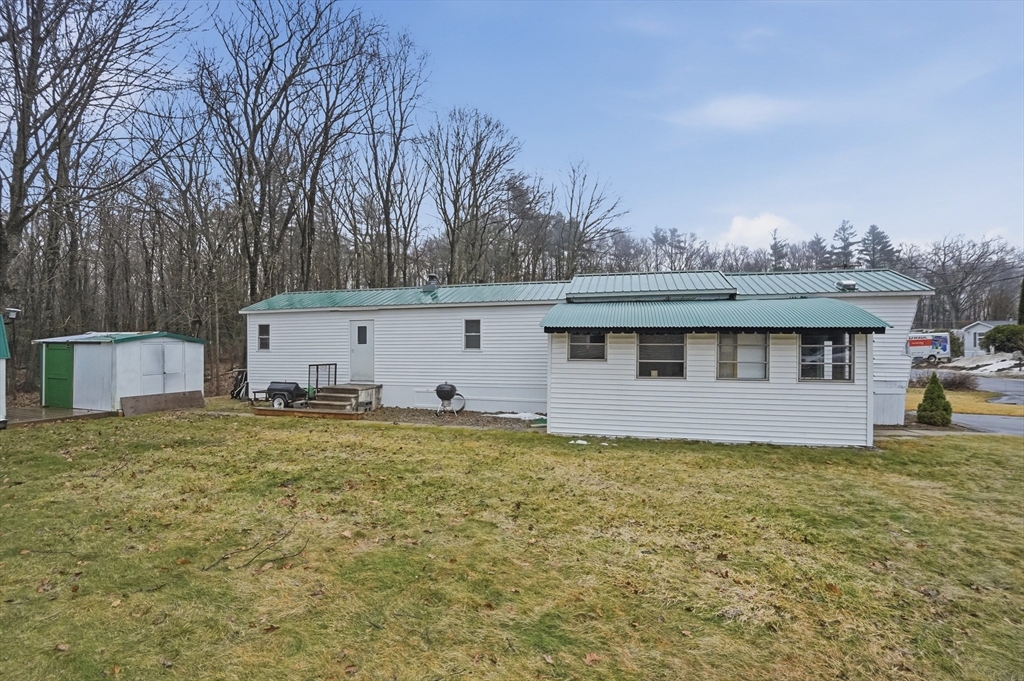 17 Conestoga Trail Brookfield, MA 01506 - Photo 17 of 20 a view of a house with backyard and a tree