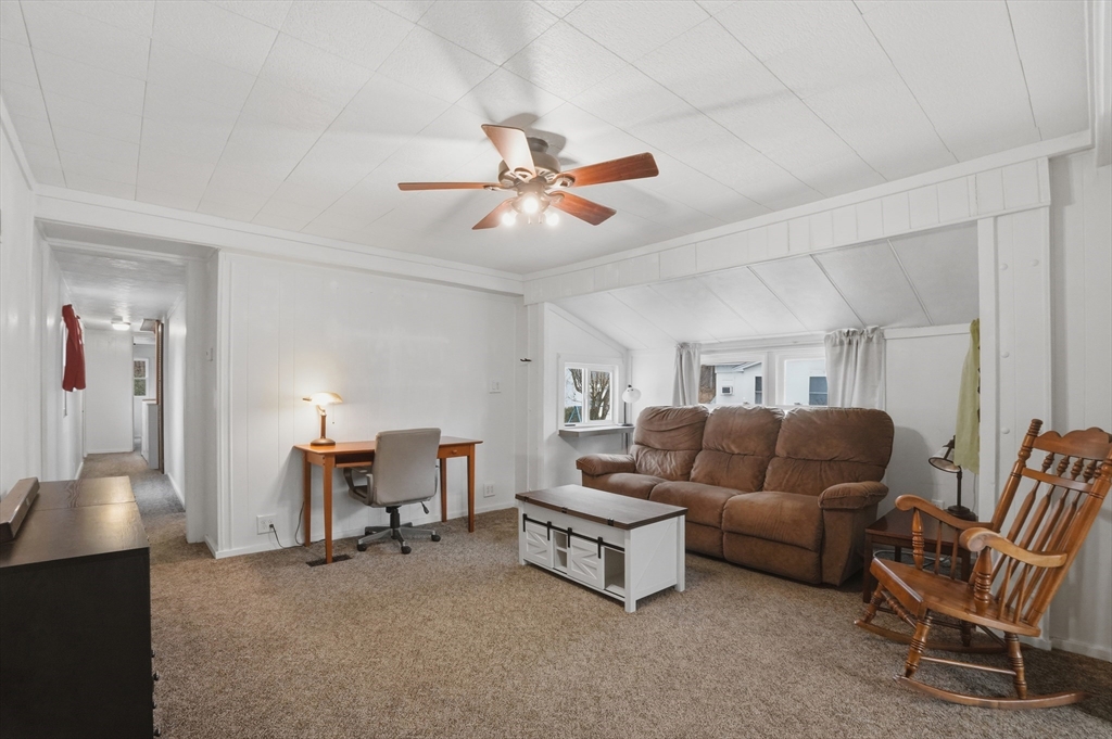 17 Conestoga Trail Brookfield, MA 01506 - Photo 7 of 20 a living room with furniture and a chandelier