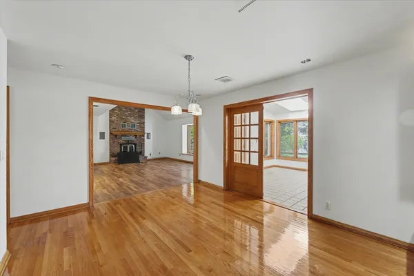 a room with wooden floor and a window