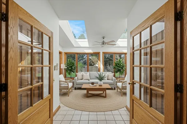 a view of entryway and hall with wooden floor