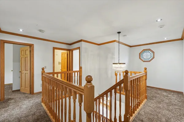 a view of a livingroom with a chandelier fan
