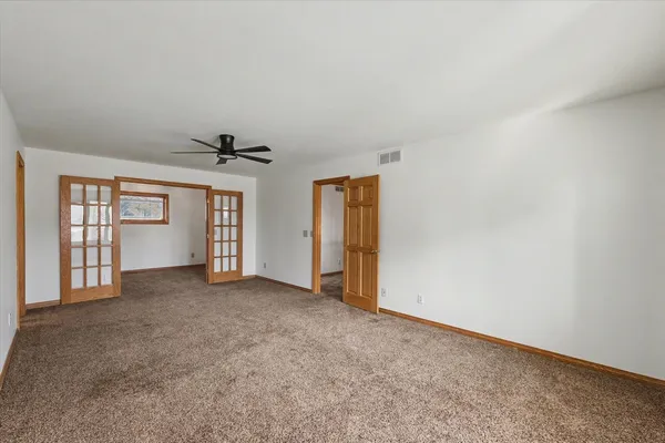 a view of walk in closet with wooden floor