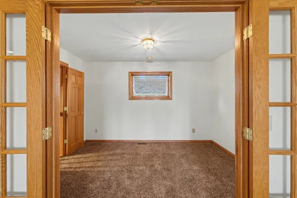 an empty room with closet area