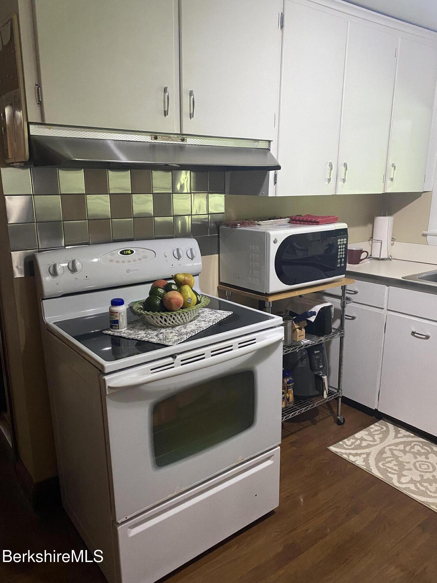 355 Laurel Street Lee, MA 01238 - Photo 2 of 19 a stove top oven sitting inside of a kitchen