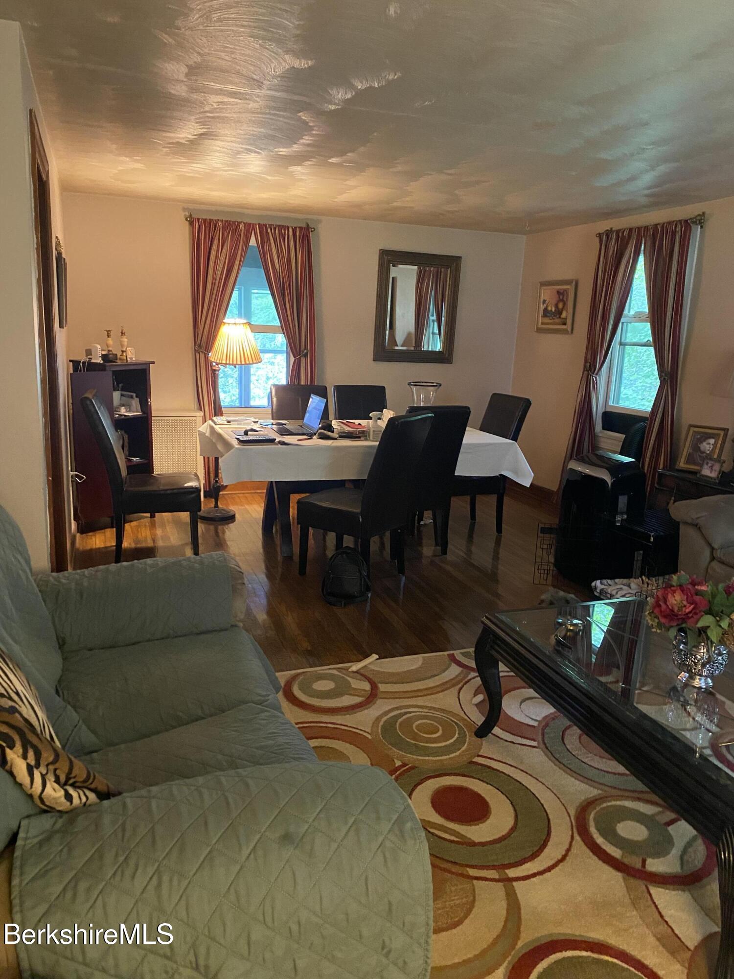 355 Laurel Street Lee, MA 01238 - Photo 6 of 19 a living room with furniture and a flat screen tv