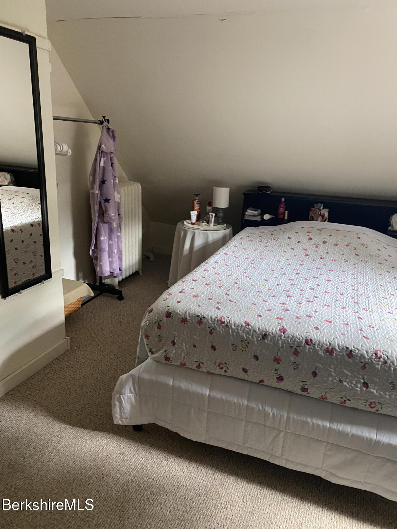 355 Laurel Street Lee, MA 01238 - Photo 8 of 19 a bedroom with a bed and a couch