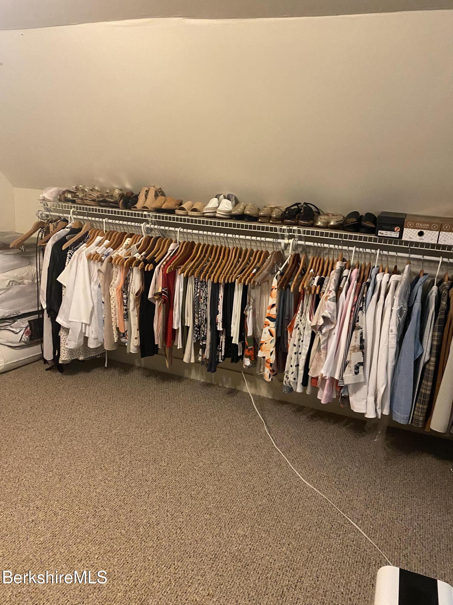 355 Laurel Street Lee, MA 01238 - Photo 10 of 19 a view of walk in closet with clothes and shoes