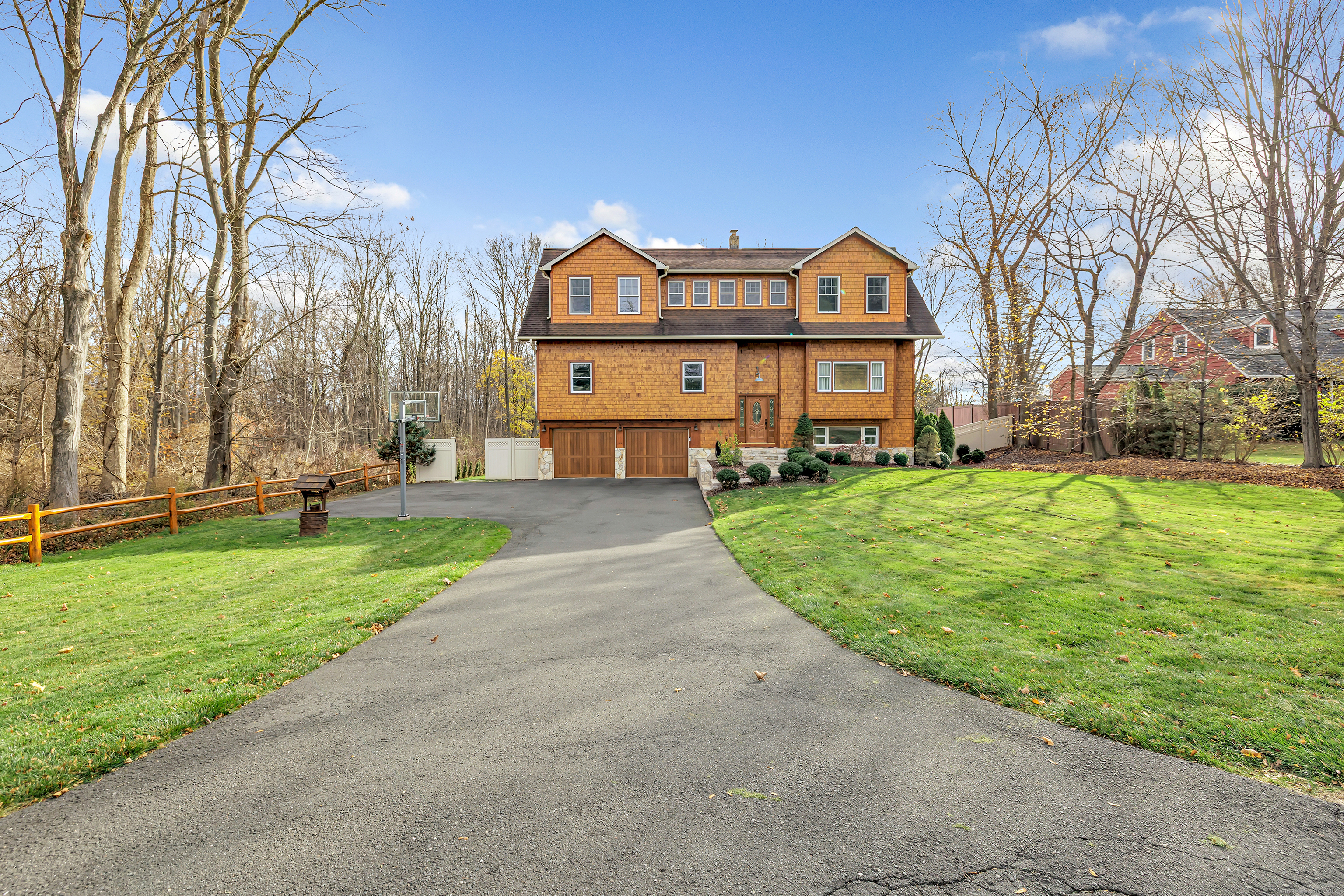 a front view of house with yard and green space