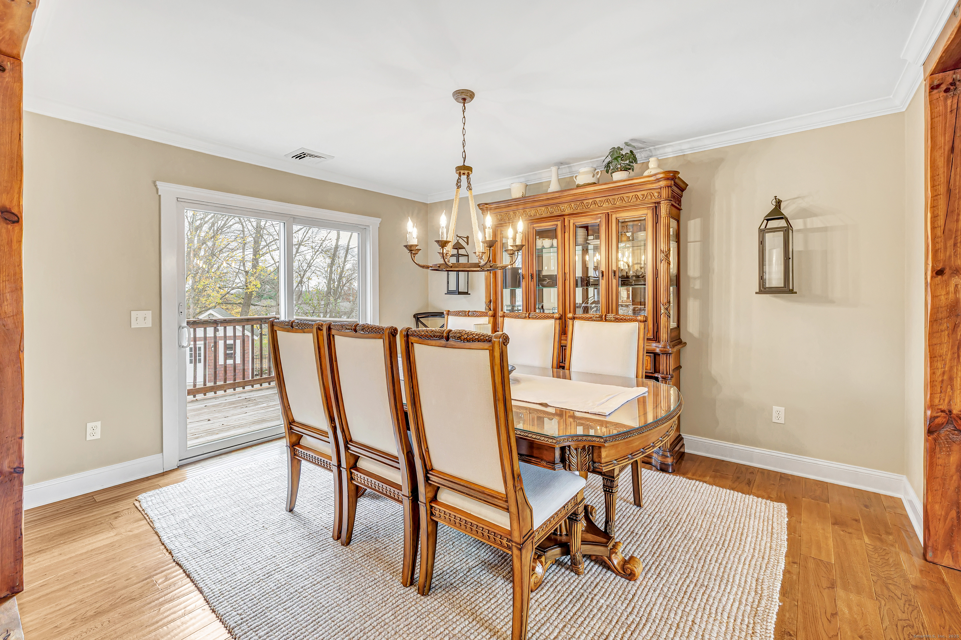 3 Great Meadow Road Danbury, CT 06811 - Photo 12 of 40 a dining room with furniture a chandelier and wooden floor