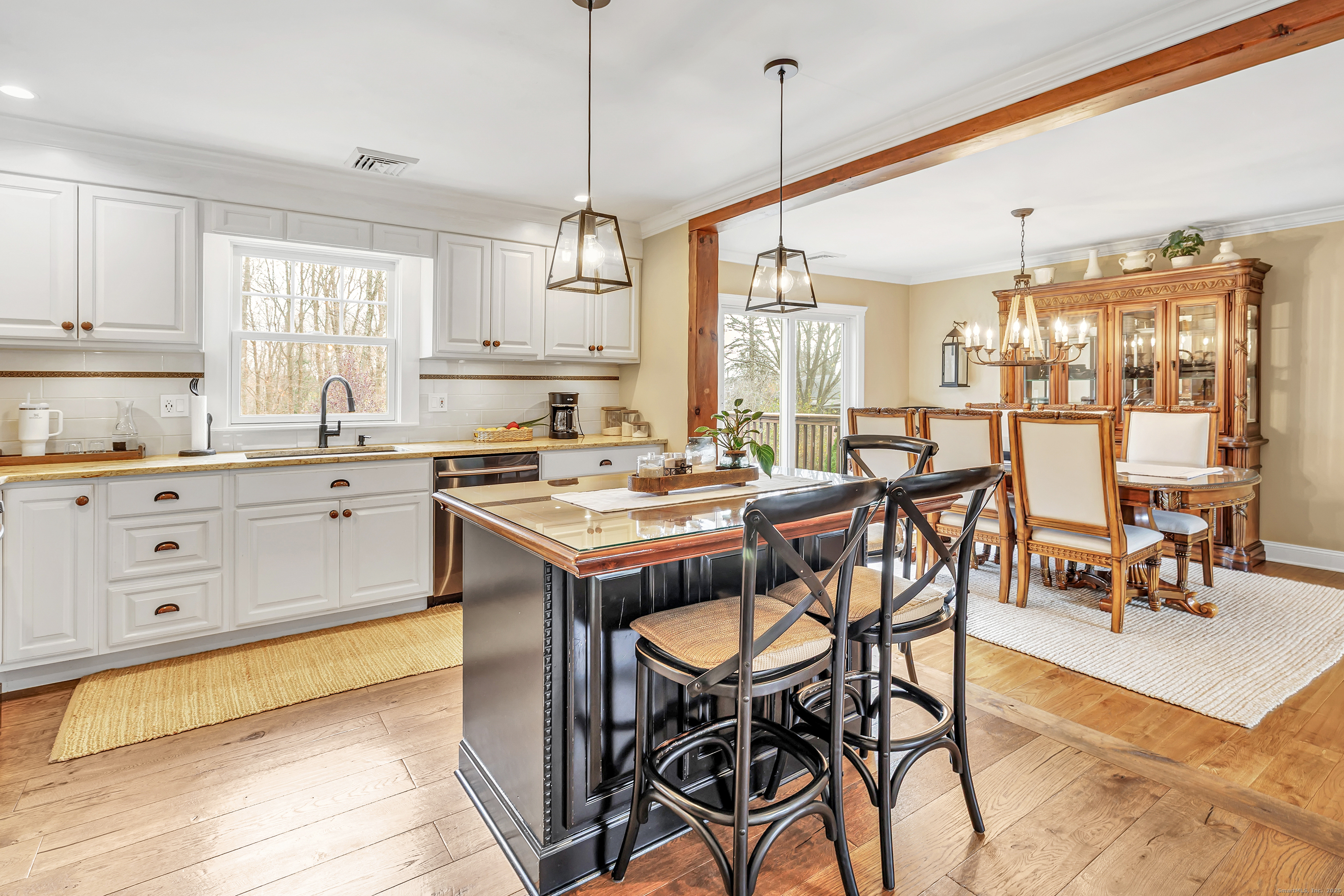 3 Great Meadow Road Danbury, CT 06811 - Photo 16 of 40 a kitchen with stainless steel appliances kitchen island granite countertop a table chairs sink and cabinets