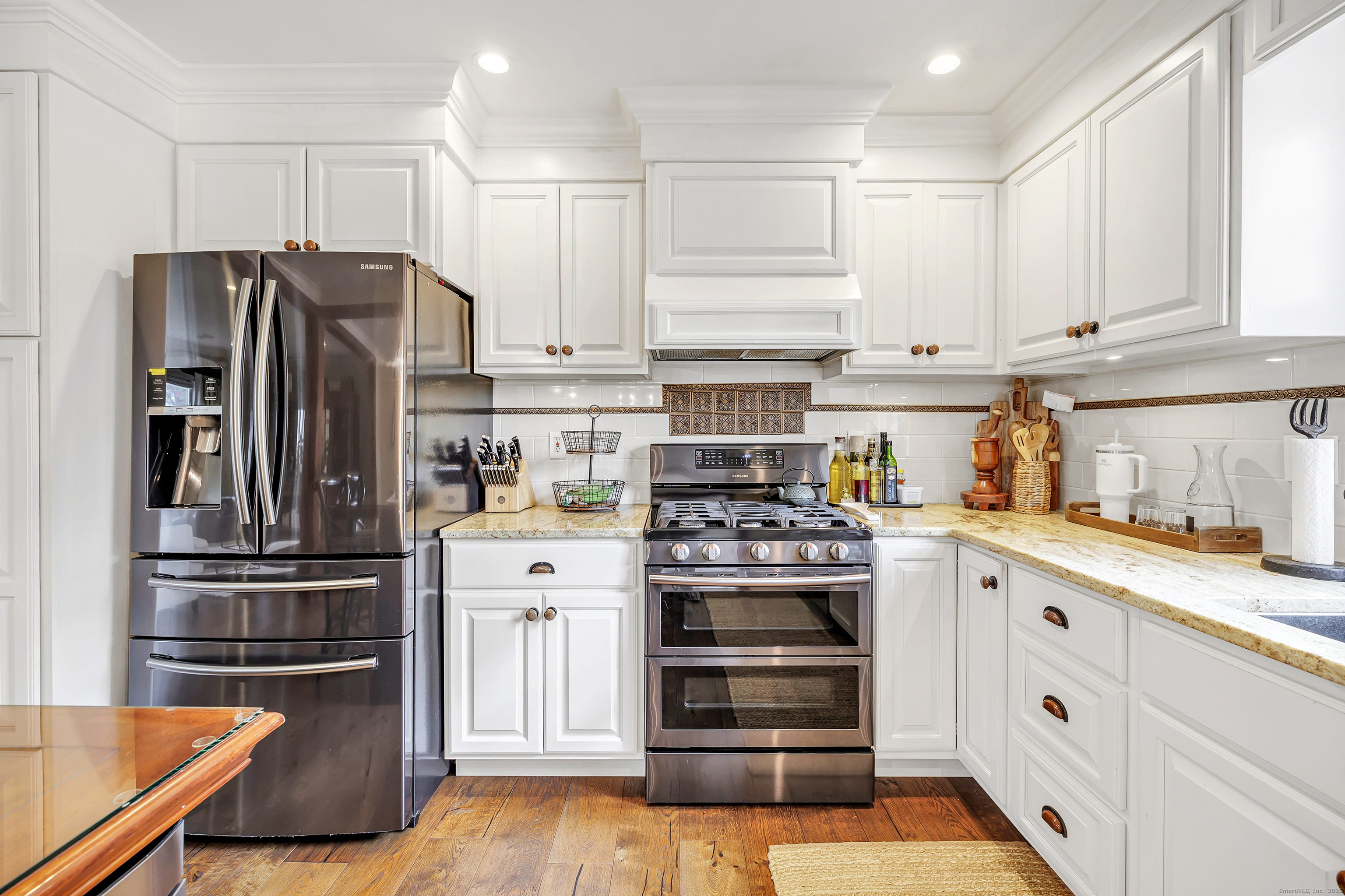 3 Great Meadow Road Danbury, CT 06811 - Photo 18 of 40 a kitchen with stainless steel appliances granite countertop a refrigerator and a stove top oven