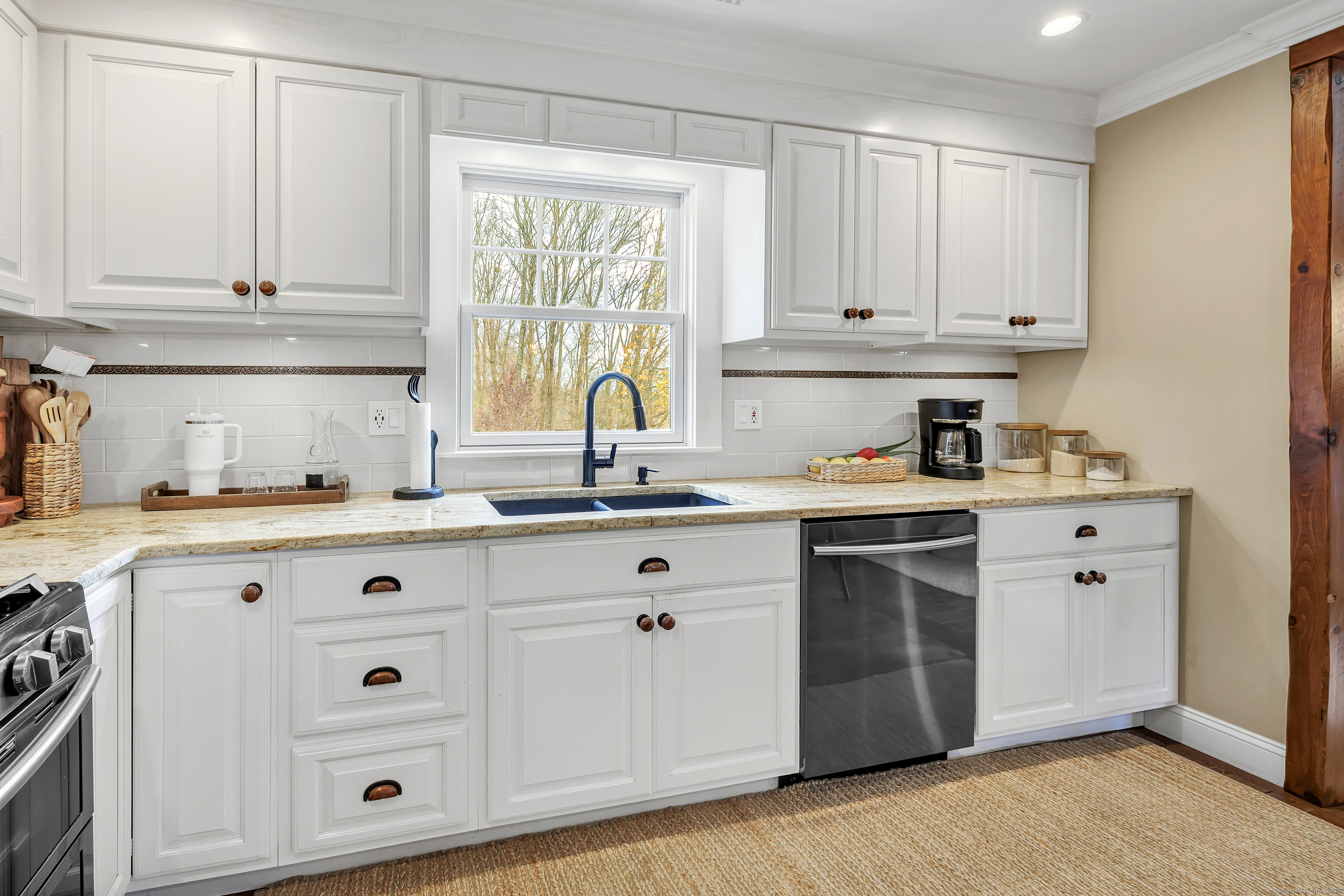 3 Great Meadow Road Danbury, CT 06811 - Photo 19 of 40 a kitchen with granite countertop white cabinets and white appliances