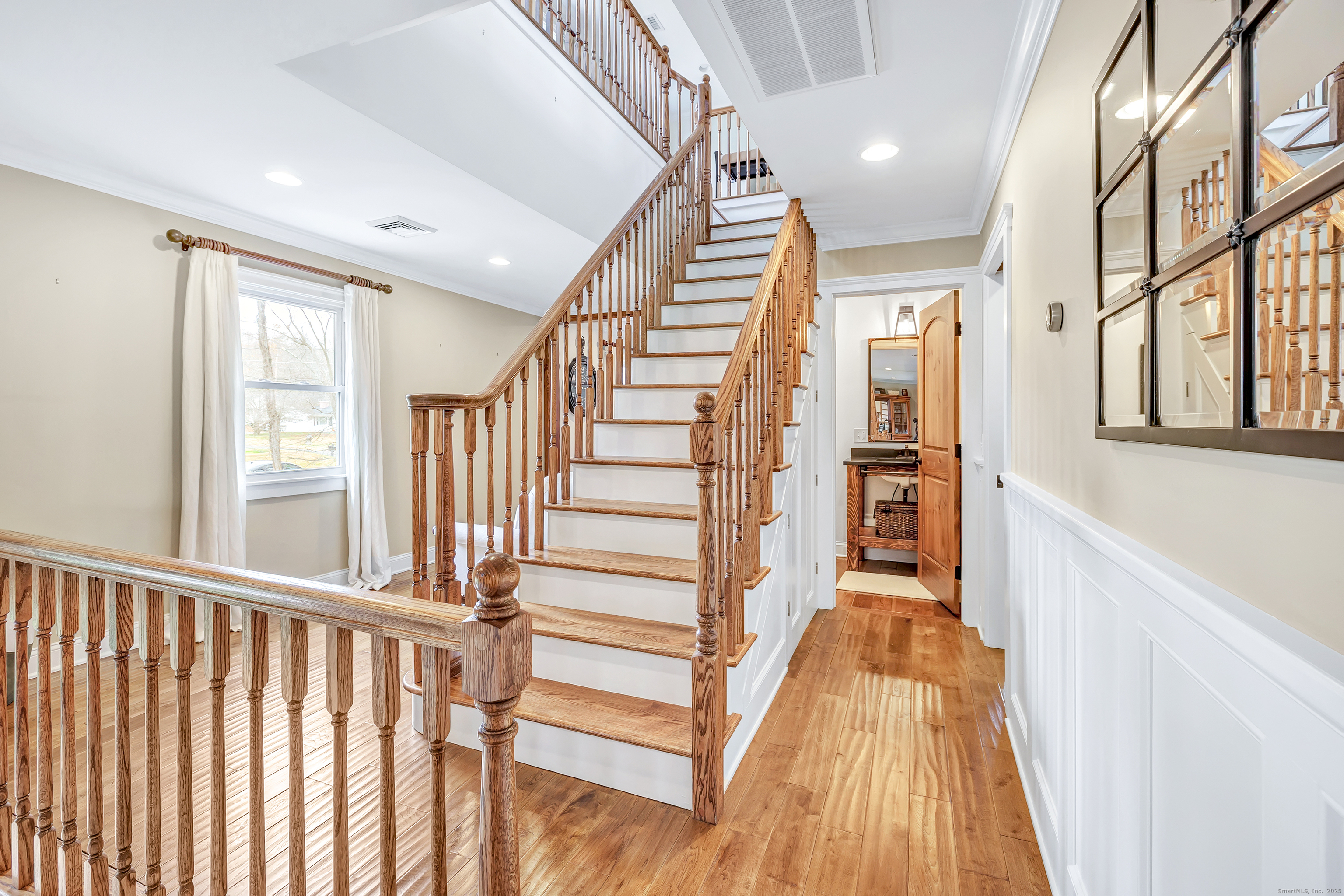3 Great Meadow Road Danbury, CT 06811 - Photo 20 of 40 a view of a hallway with wooden floor and staircase