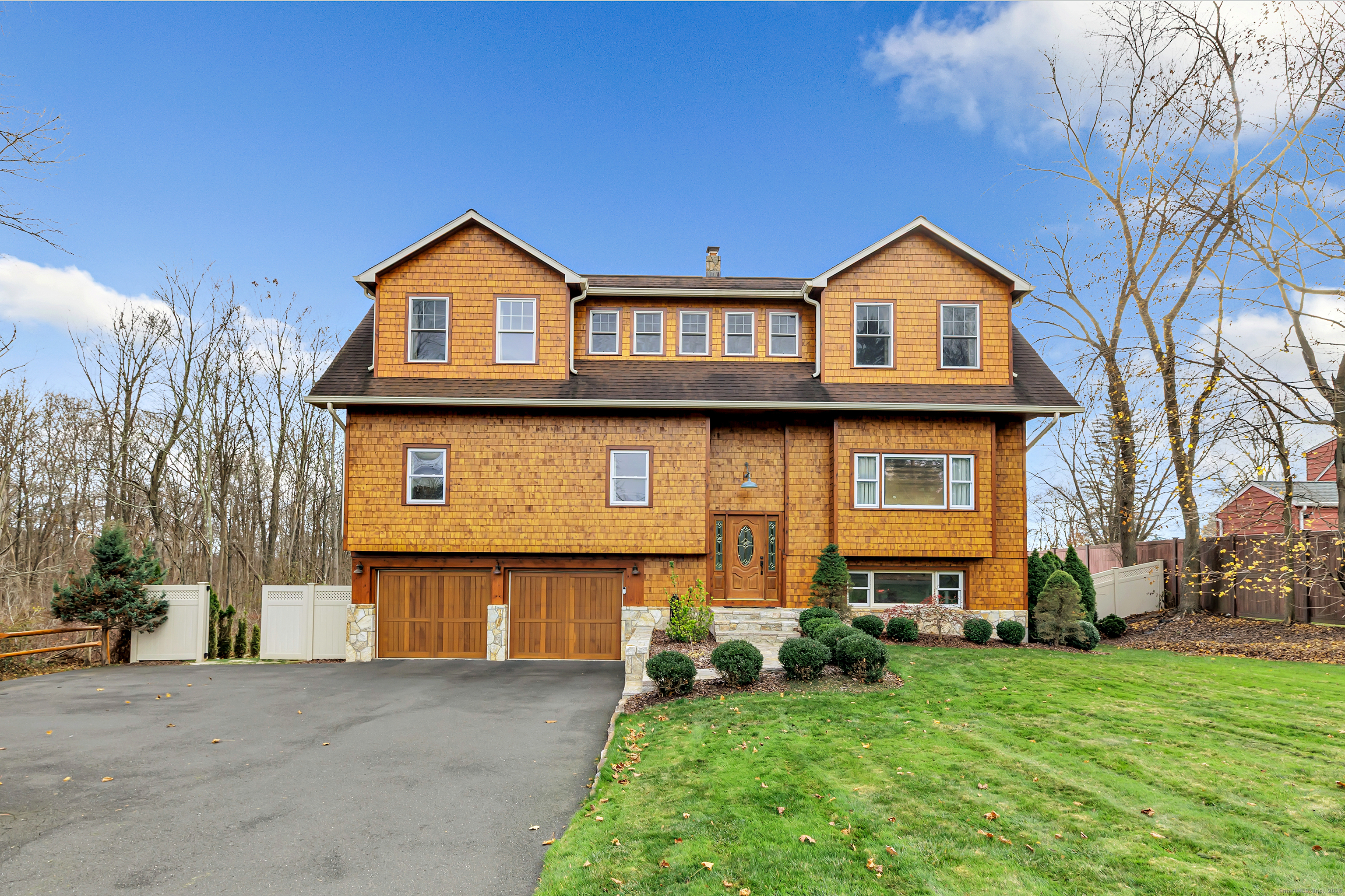3 Great Meadow Road Danbury, CT 06811 - Photo 2 of 40 a front view of a house with garden