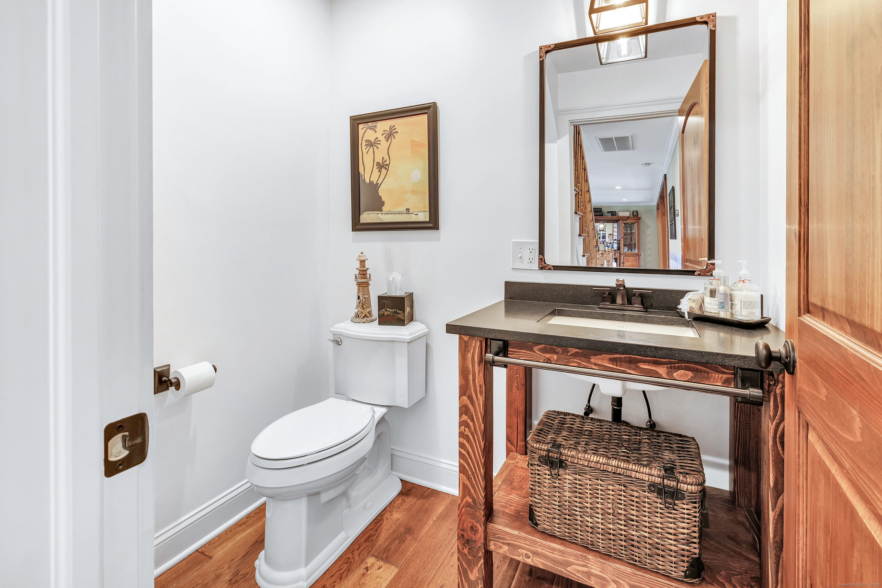 3 Great Meadow Road Danbury, CT 06811 - Photo 21 of 40 a bathroom with a toilet a sink and mirror