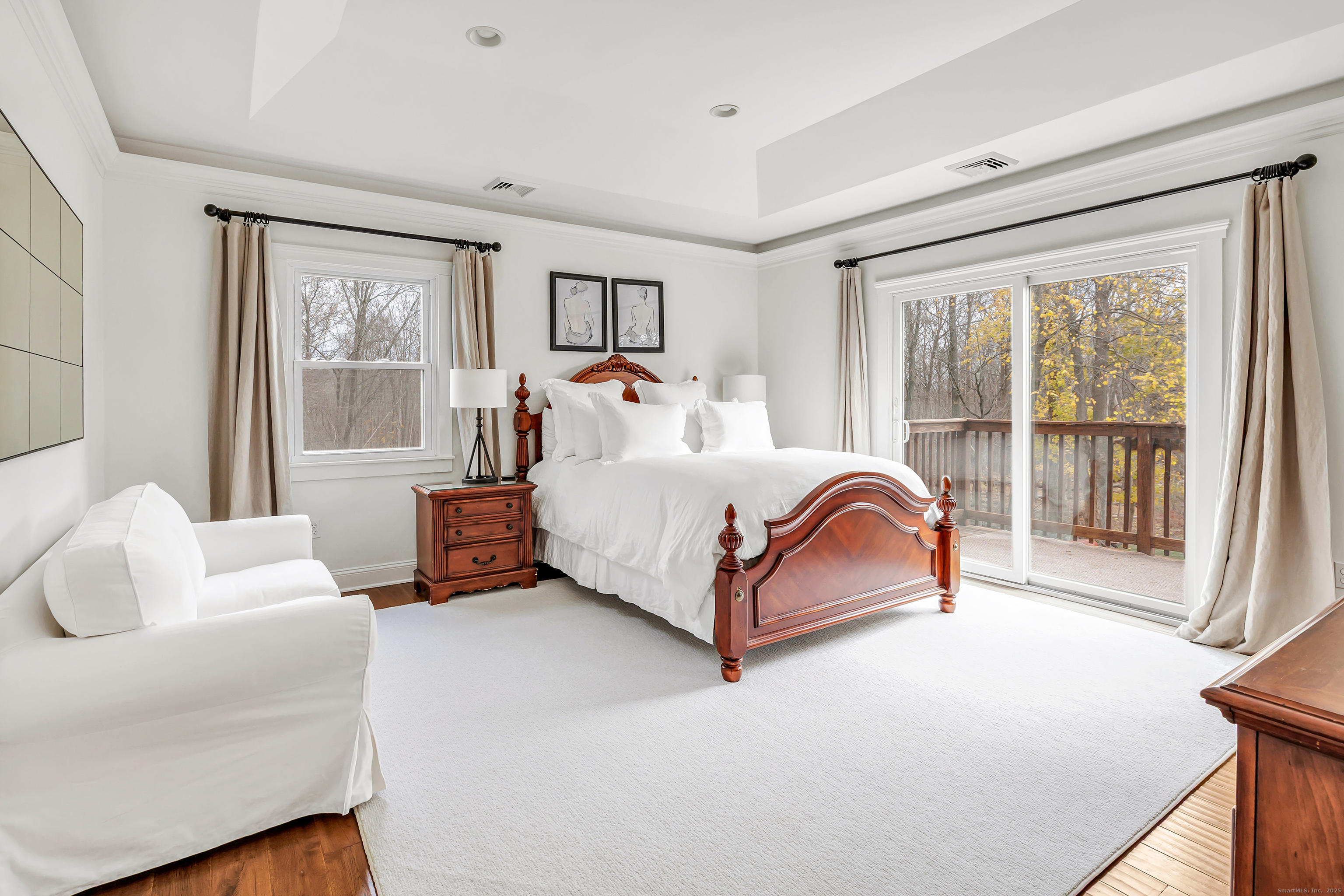 3 Great Meadow Road Danbury, CT 06811 - Photo 22 of 40 a bedroom with a bed and large window with outer view