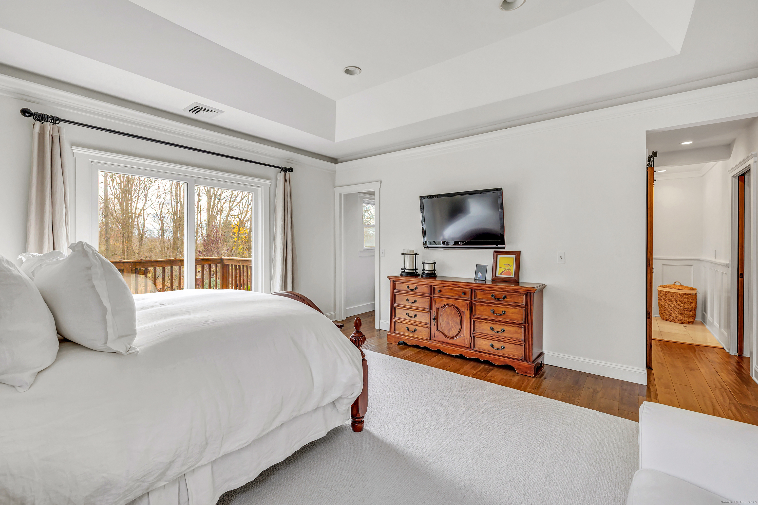 3 Great Meadow Road Danbury, CT 06811 - Photo 23 of 40 a bedroom with a bed and a flat screen television