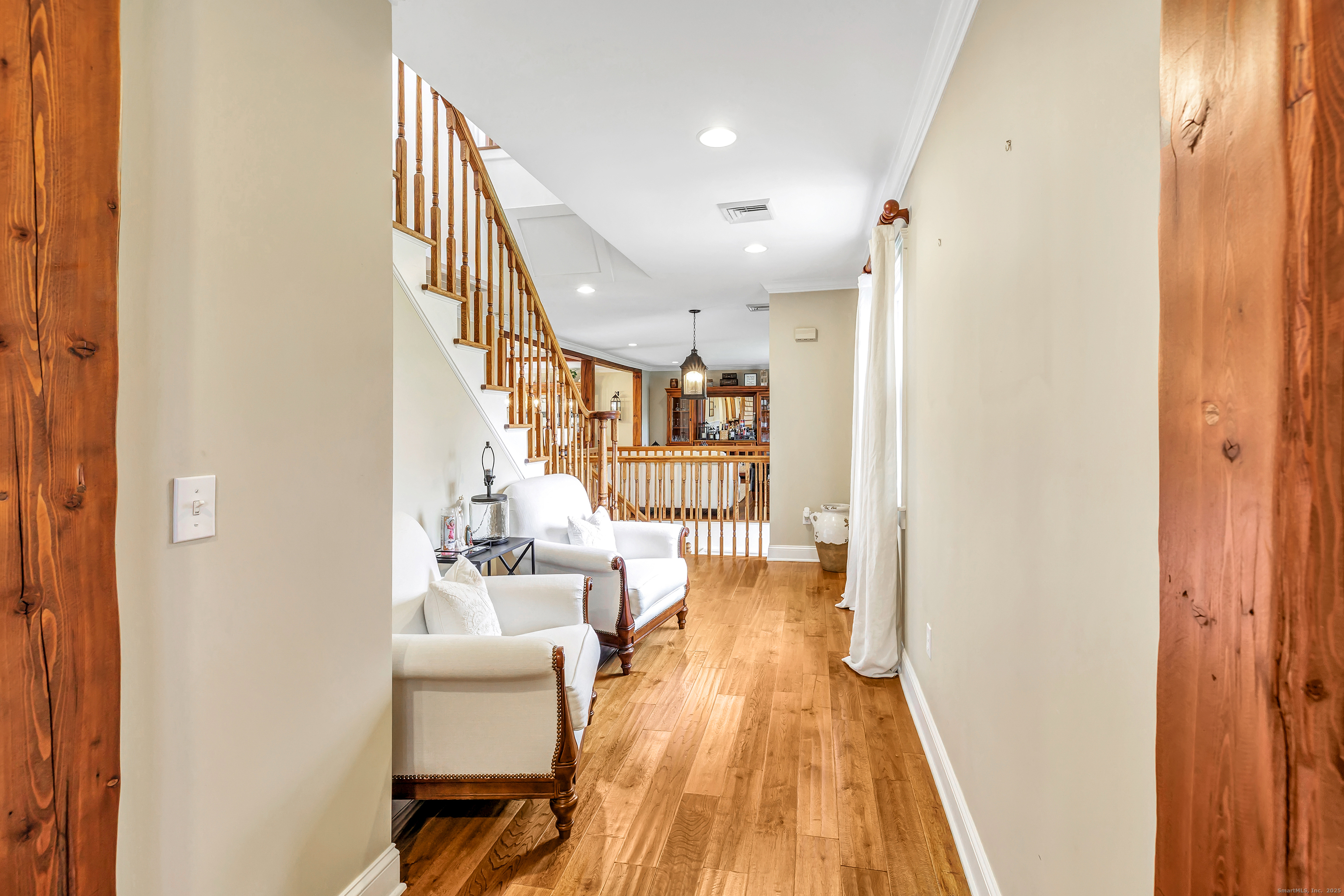 3 Great Meadow Road Danbury, CT 06811 - Photo 26 of 40 a living room with furniture and a wooden floor