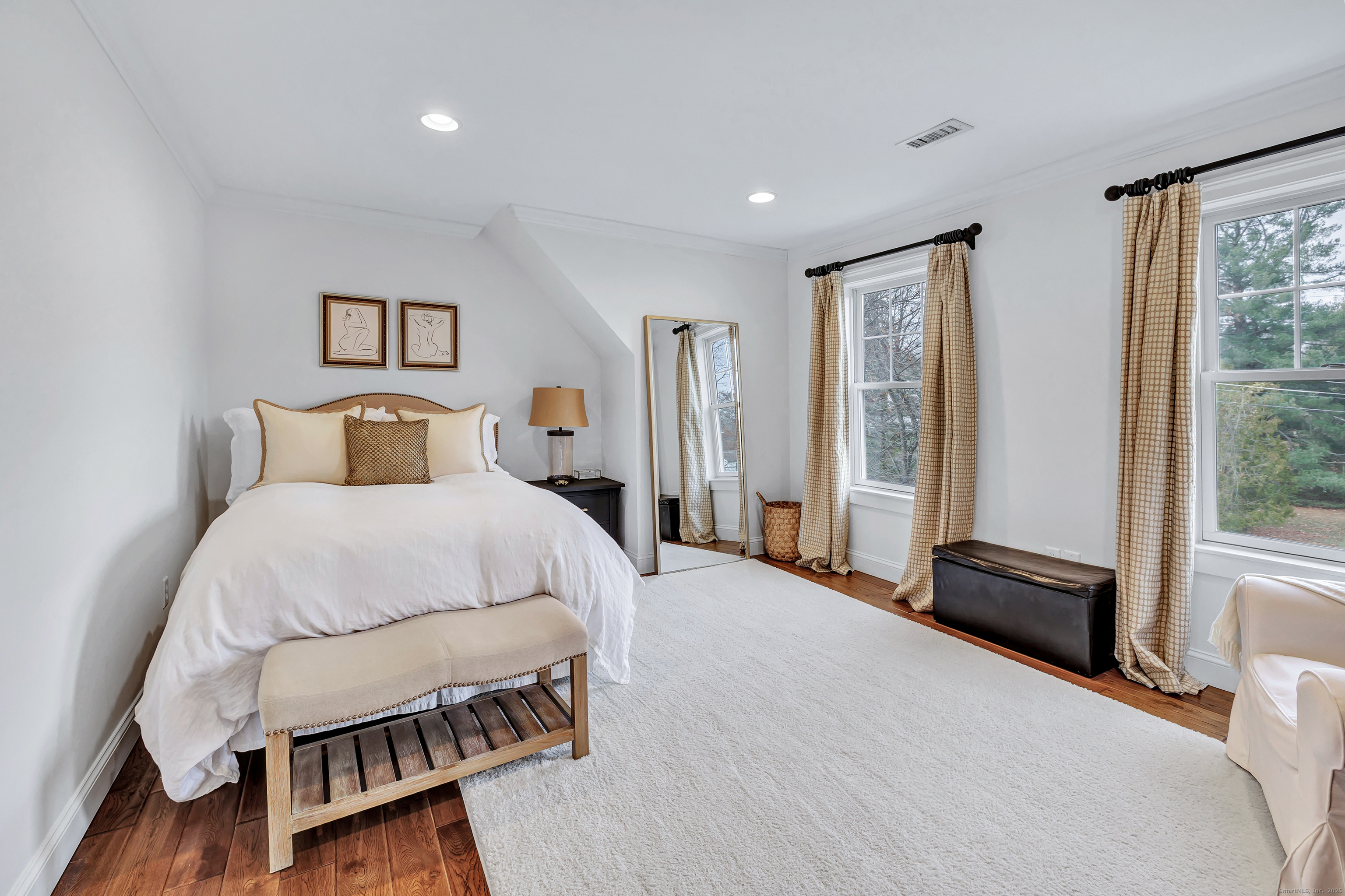 3 Great Meadow Road Danbury, CT 06811 - Photo 35 of 40 a bedroom with a bed and wooden floor