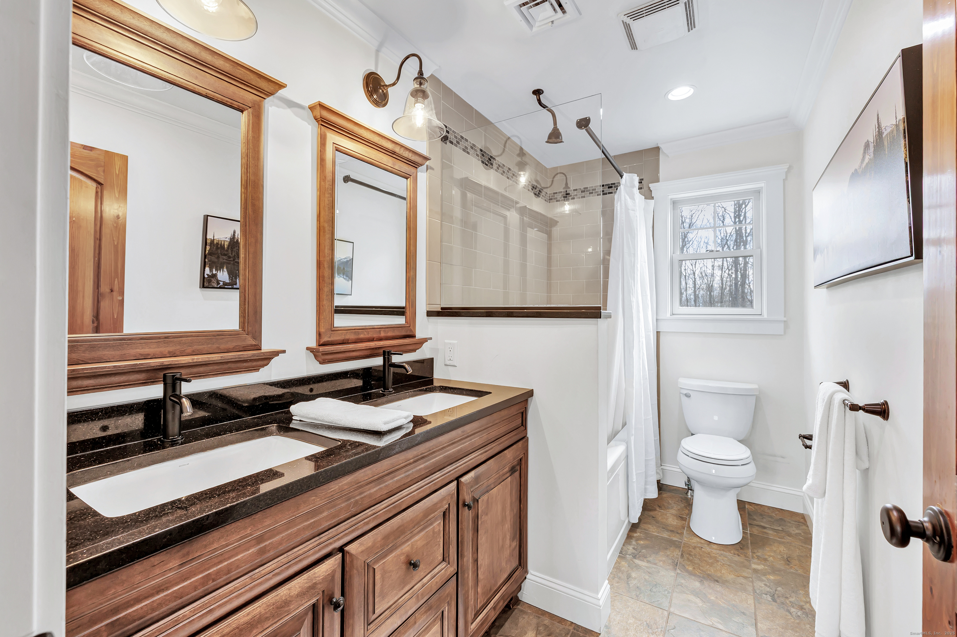 3 Great Meadow Road Danbury, CT 06811 - Photo 36 of 40 a bathroom with a sink a toilet a mirror and shower