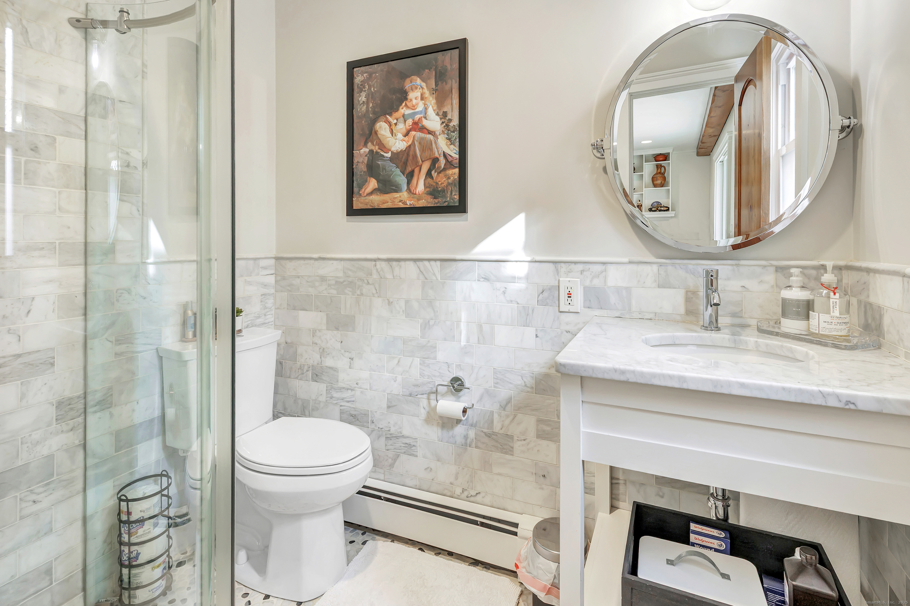 3 Great Meadow Road Danbury, CT 06811 - Photo 38 of 40 a bathroom with a toilet a sink and mirror