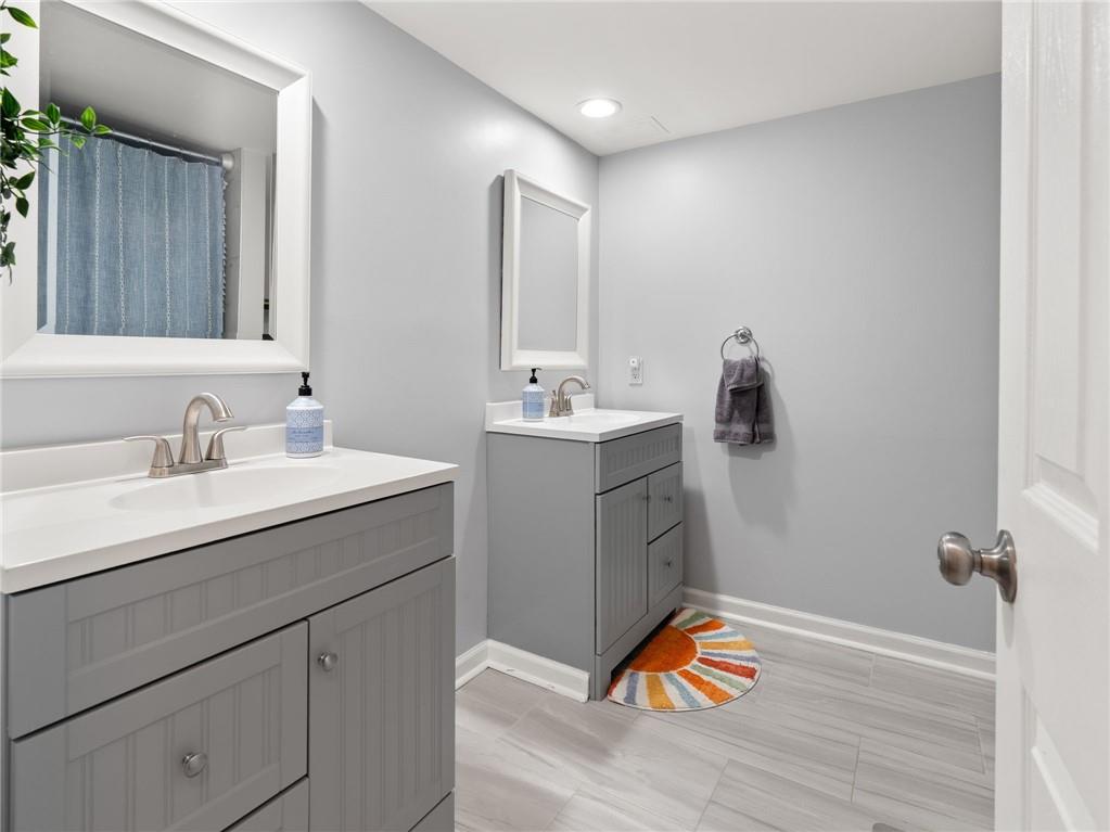 6851 Roswell Road, Unit H26 Atlanta, GA 30328 - Photo 22 of 49 a bathroom with a sink vanity granite and toilet