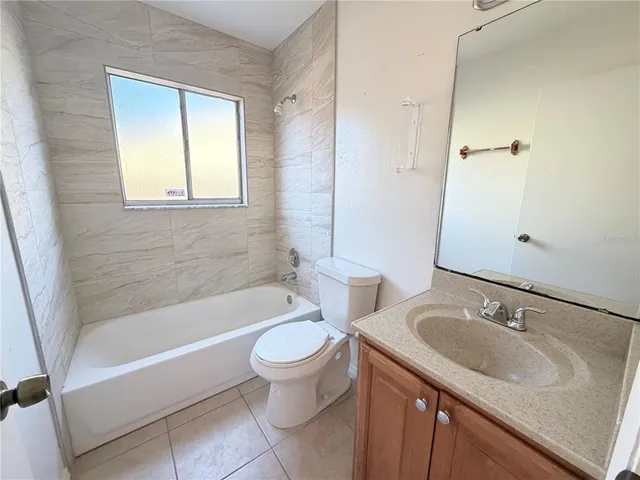 a bathroom with a sink toilet and bathtub