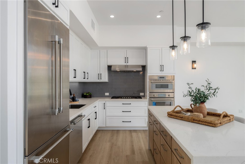 2648 State Street Carlsbad, CA 92008 - Photo 3 of 24 a kitchen with granite countertop a sink stove and refrigerator