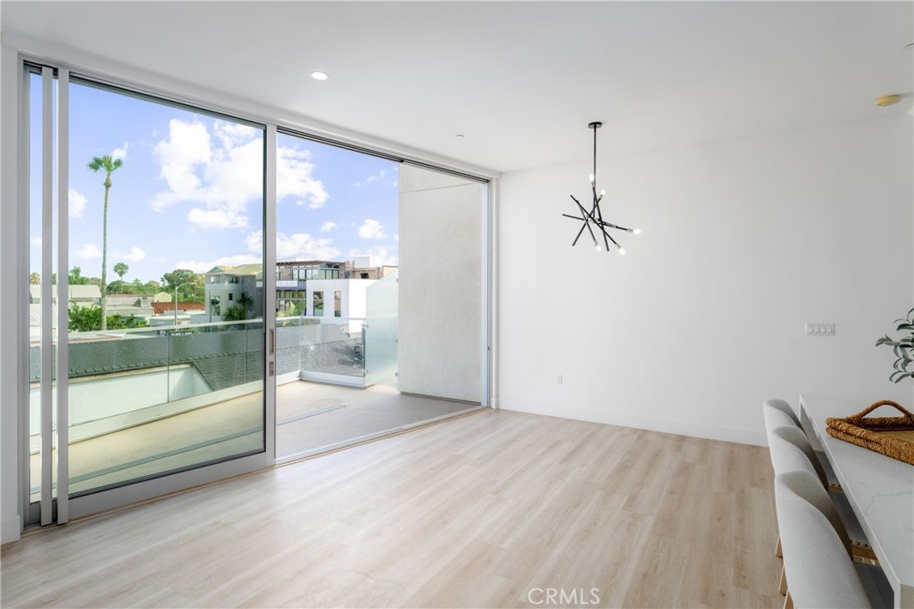 2648 State Street Carlsbad, CA 92008 - Photo 6 of 24 a view of a room with wooden floor and windows
