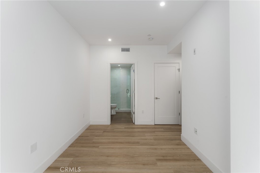 2648 State Street Carlsbad, CA 92008 - Photo 8 of 24 a view of a hallway with wooden floor