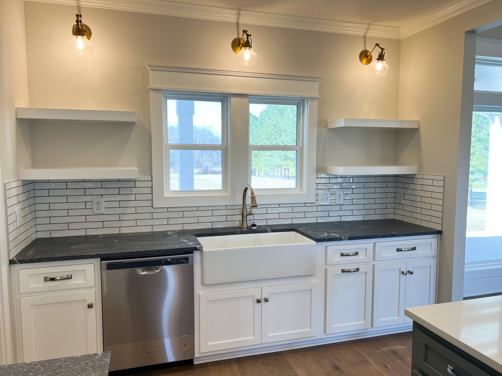 2040 Cairo Bend Road Lebanon, TN 37087 - Photo 13 of 38 a kitchen with granite countertop white cabinets and sink