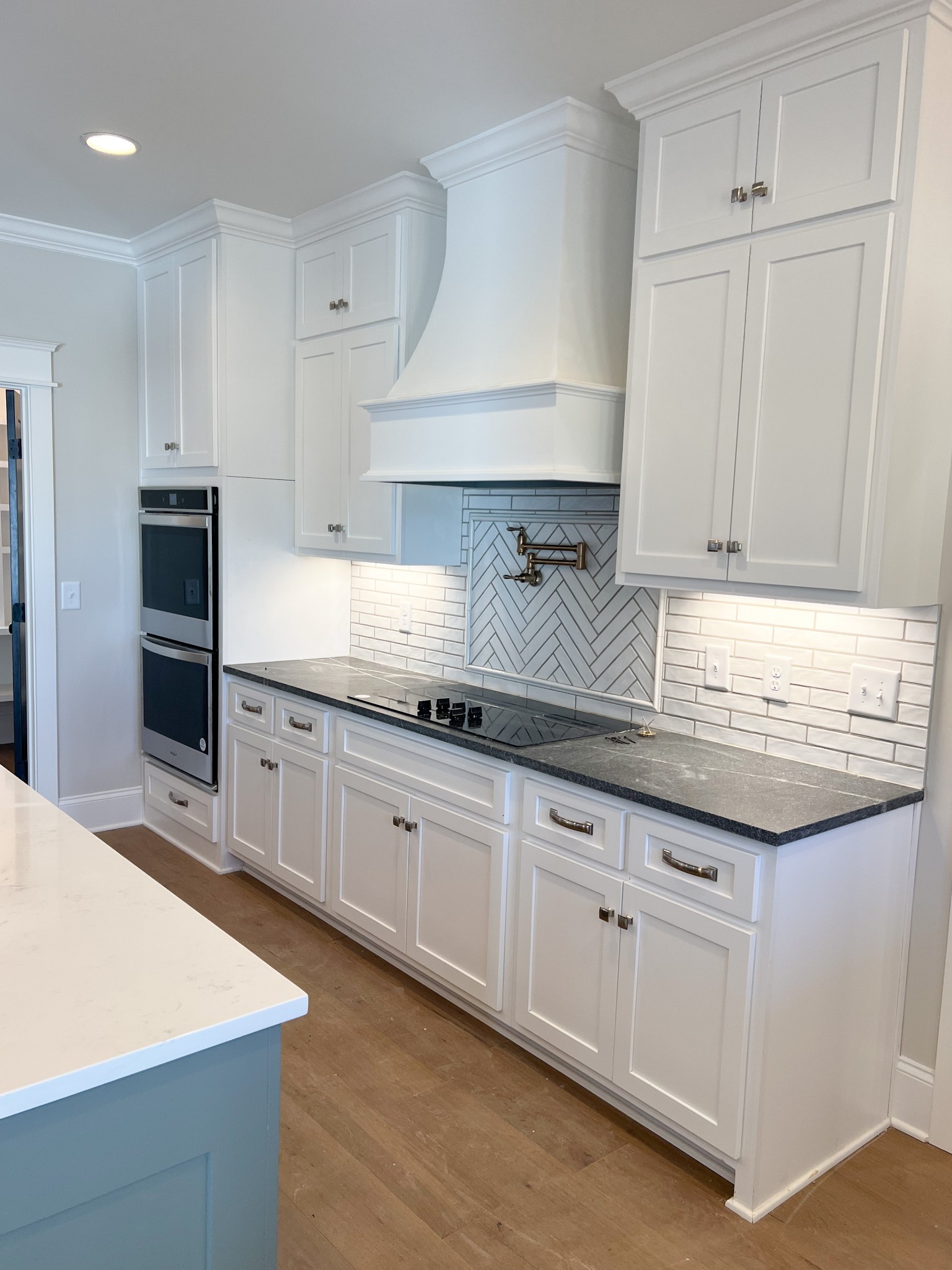 2040 Cairo Bend Road Lebanon, TN 37087 - Photo 14 of 38 a kitchen with granite countertop white cabinets and white appliances