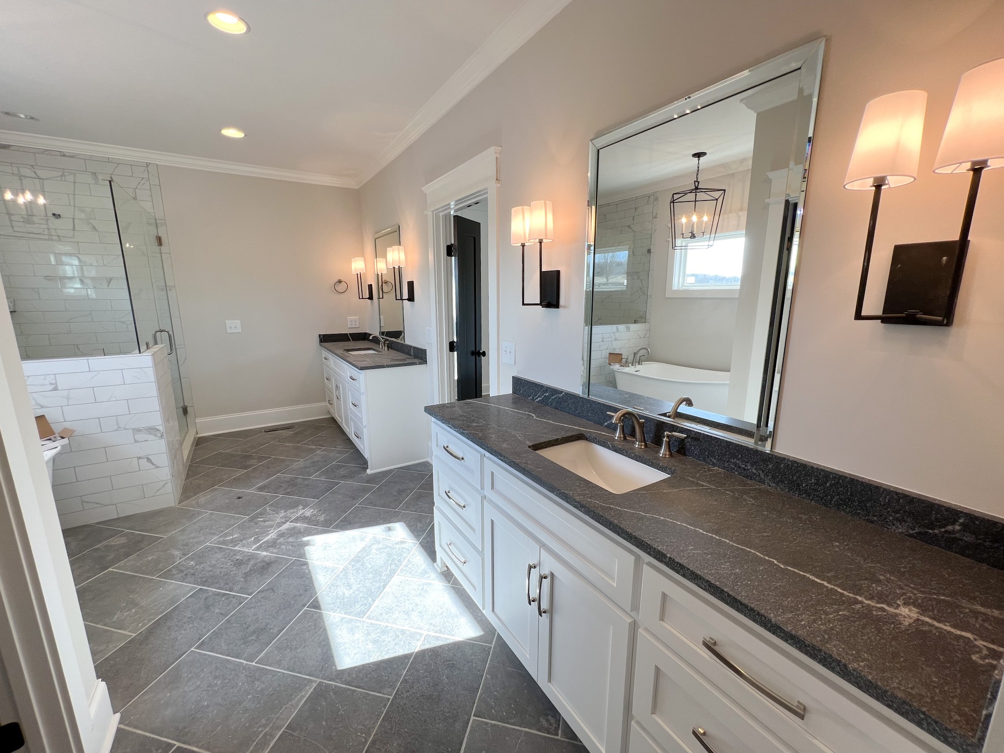 2040 Cairo Bend Road Lebanon, TN 37087 - Photo 21 of 38 a large bathroom with a double vanity sink and a mirror