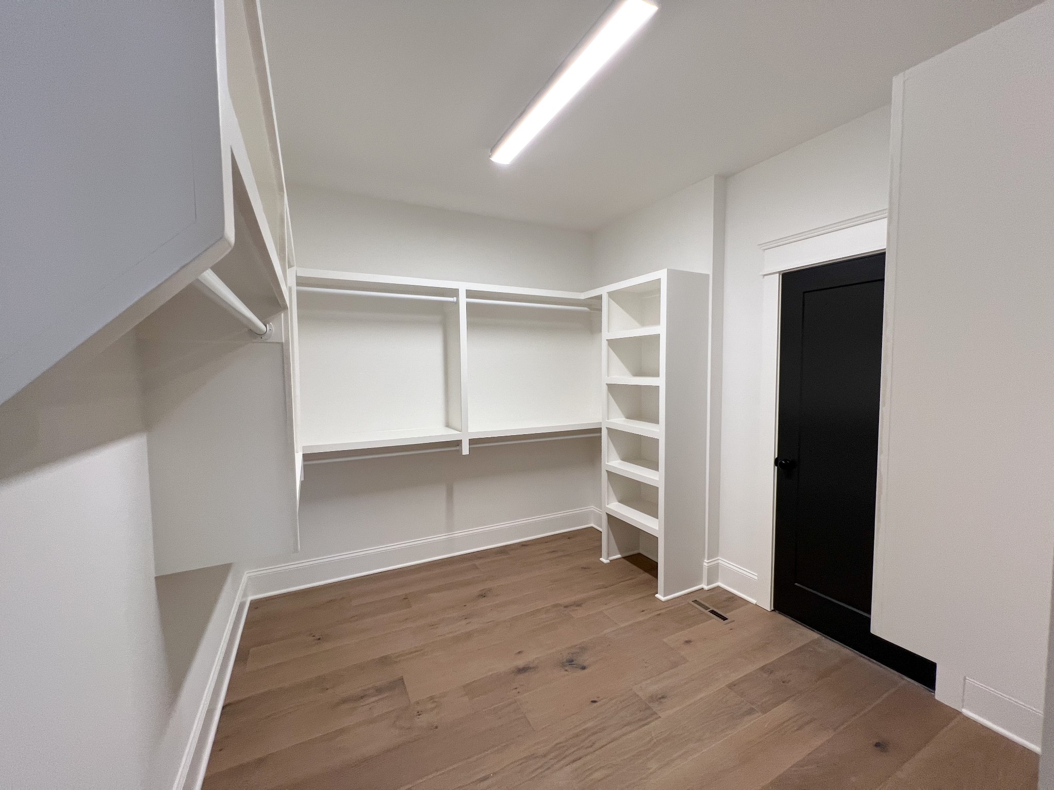 2040 Cairo Bend Road Lebanon, TN 37087 - Photo 22 of 38 an empty room with closet and wooden floor