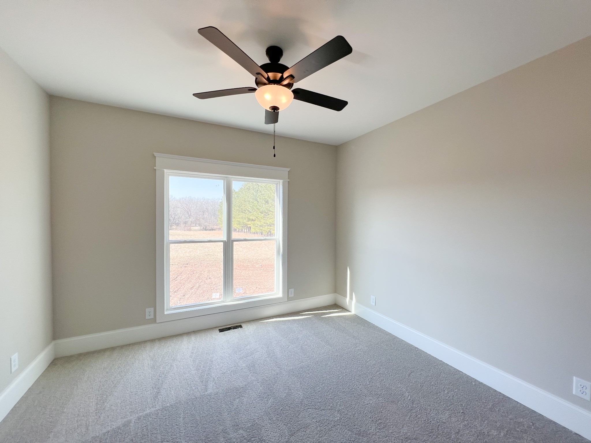 2040 Cairo Bend Road Lebanon, TN 37087 - Photo 27 of 38 an empty room with a window and a fan