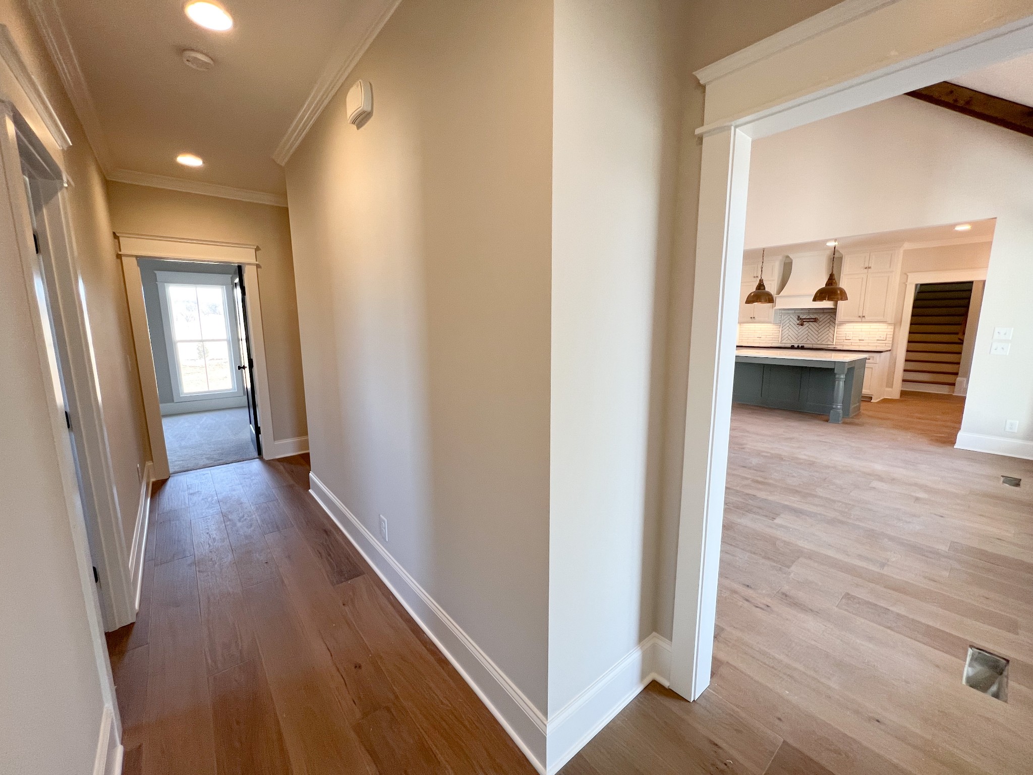 2040 Cairo Bend Road Lebanon, TN 37087 - Photo 28 of 38 a view of a hallway with wooden floor and a kitchen