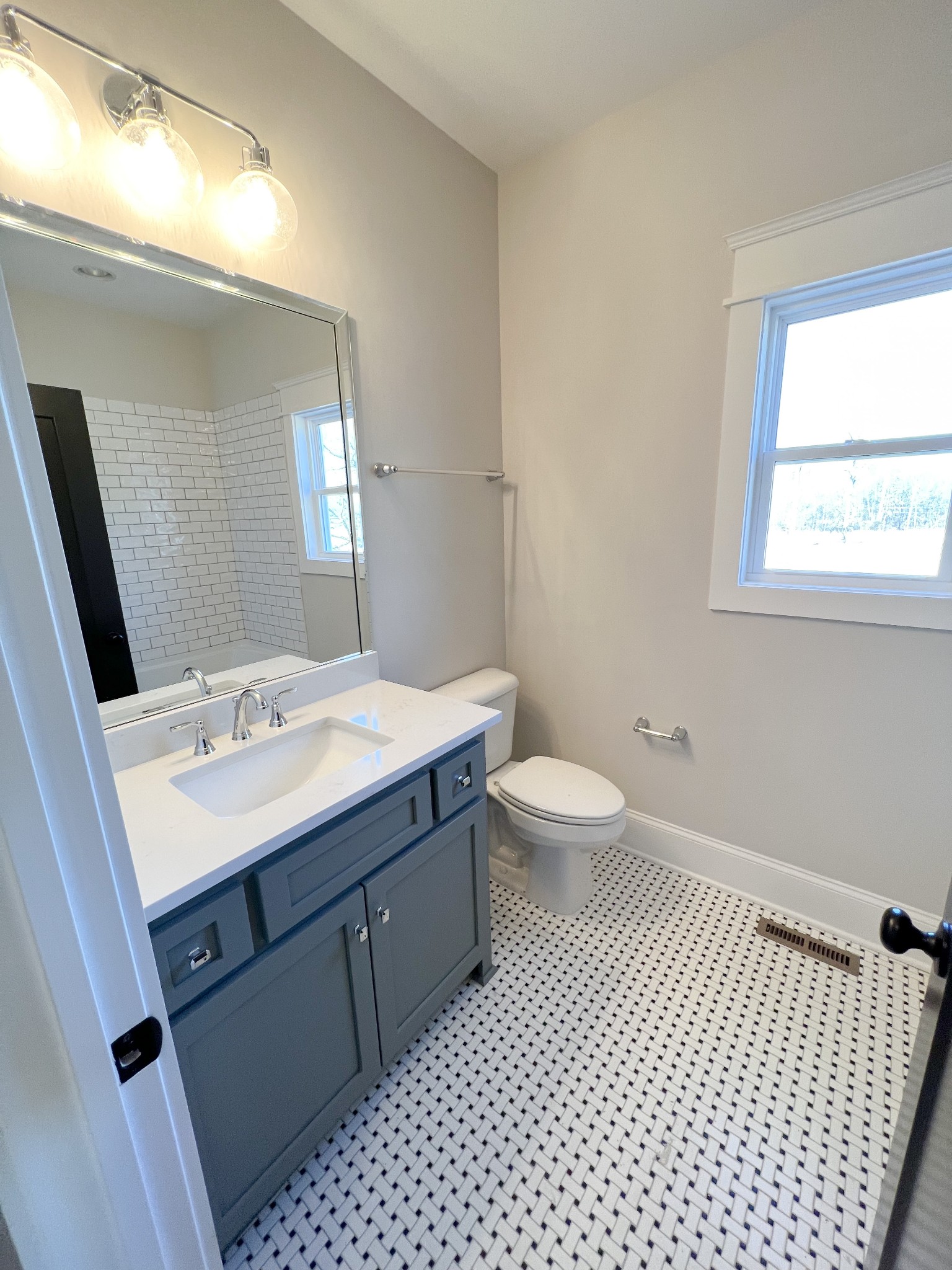 2040 Cairo Bend Road Lebanon, TN 37087 - Photo 29 of 38 a bathroom with a sink a toilet a mirror and shower
