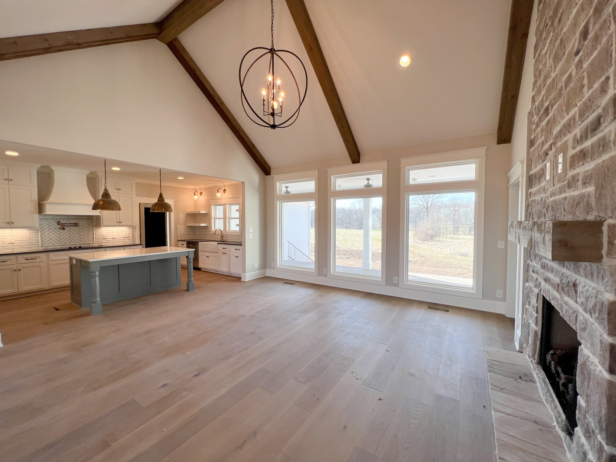 2040 Cairo Bend Road Lebanon, TN 37087 - Photo 9 of 38 a view of a kitchen with furniture and a fireplace