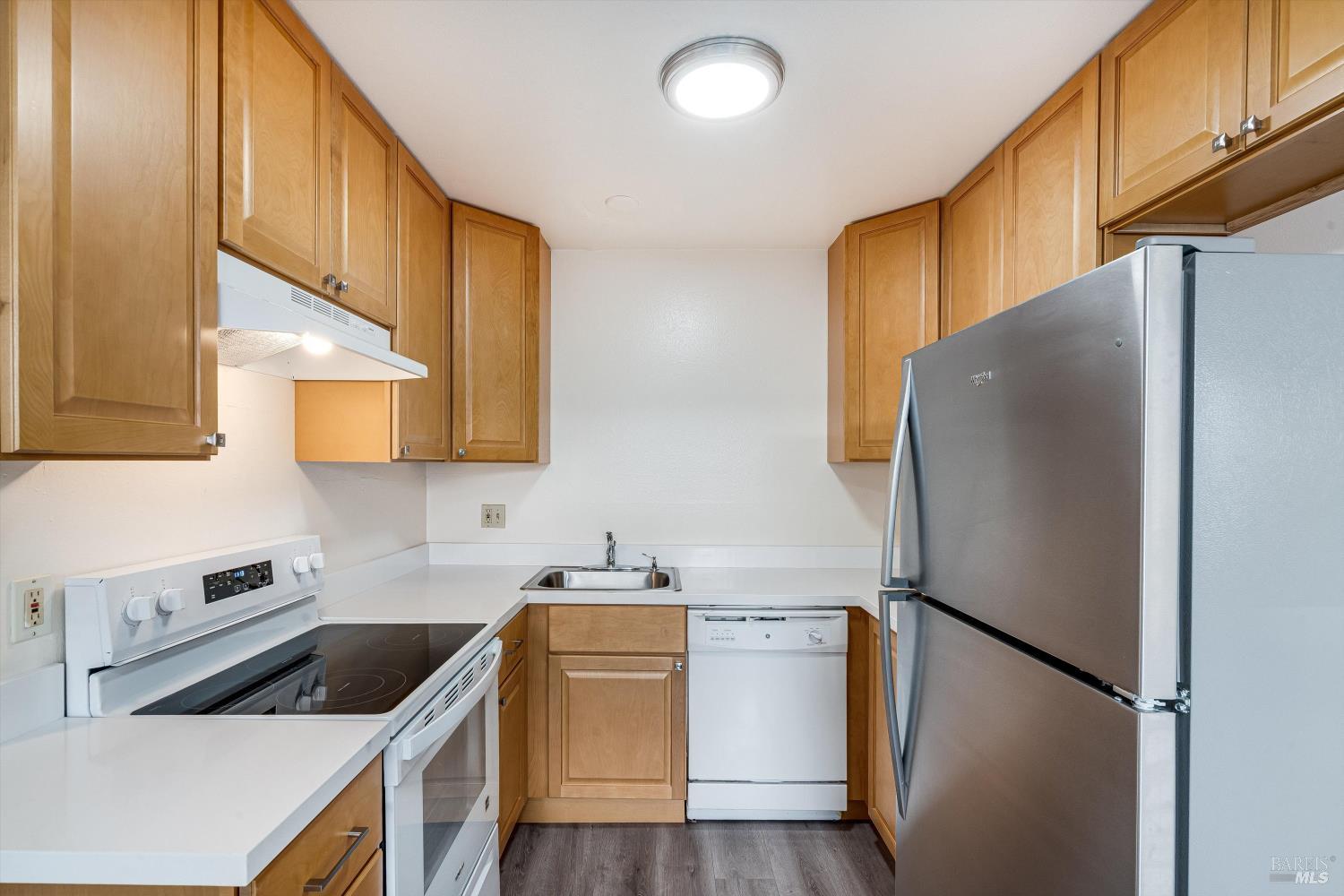 220-226 Arlen Drive Rohnert Park, CA 94928 - Photo 12 of 56 a kitchen with a refrigerator sink and cabinets