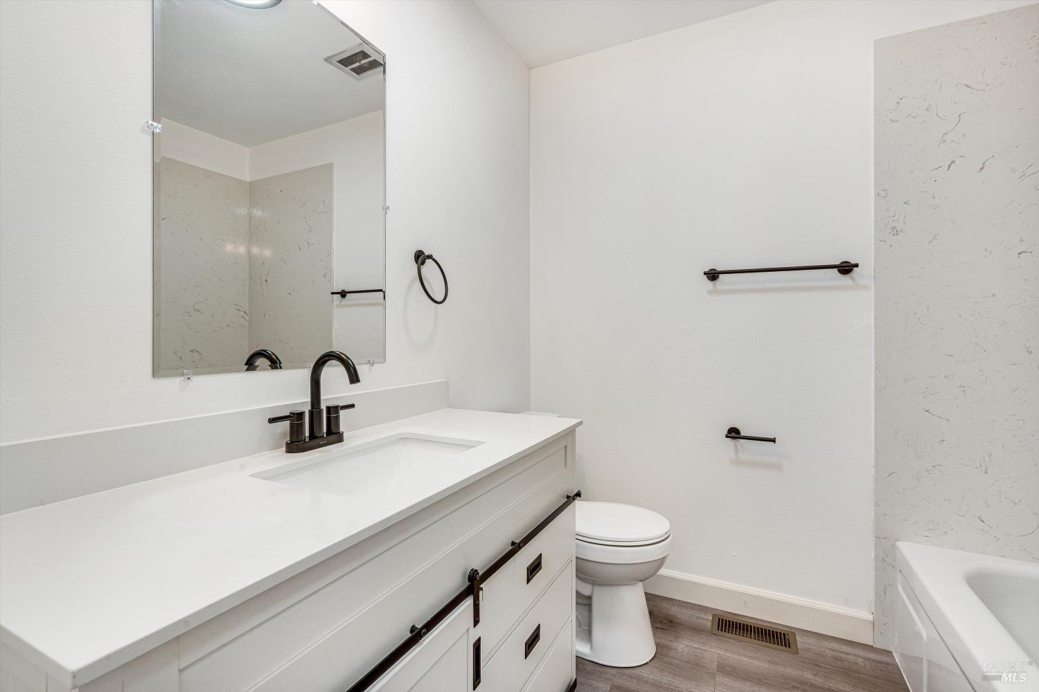 220-226 Arlen Drive Rohnert Park, CA 94928 - Photo 20 of 56 a bathroom with a sink toilet and shower