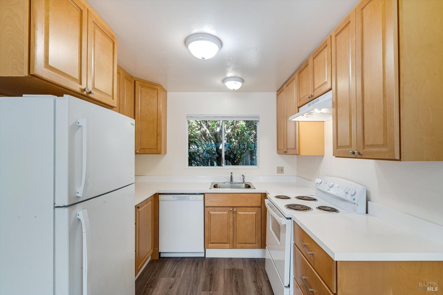220-226 Arlen Drive Rohnert Park, CA 94928 - Photo 30 of 56 a kitchen with a sink a refrigerator and window