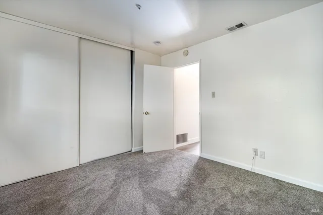 a view of a house with a tree