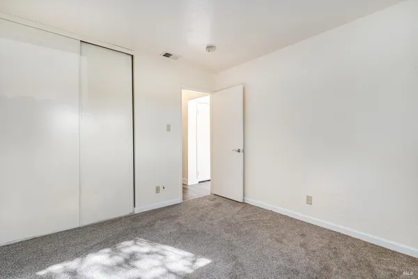 a view of a bathroom from a corridor
