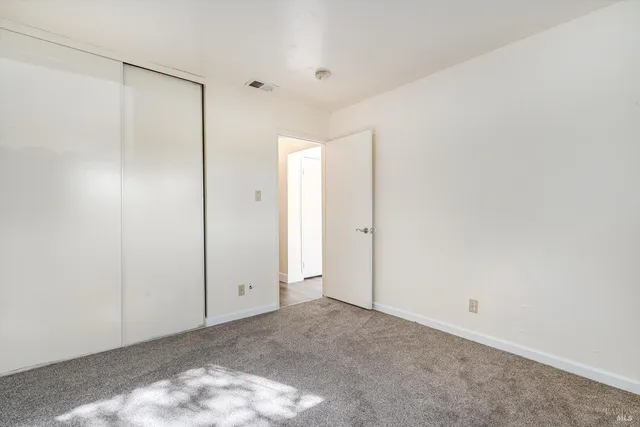 a view of a bathroom from a corridor