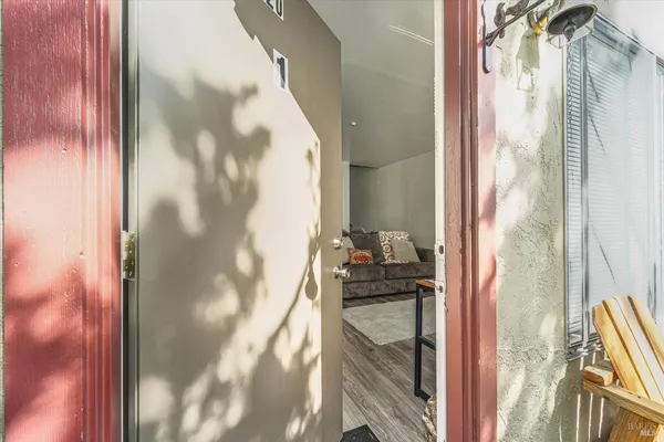 a kitchen with a refrigerator and a stove top oven