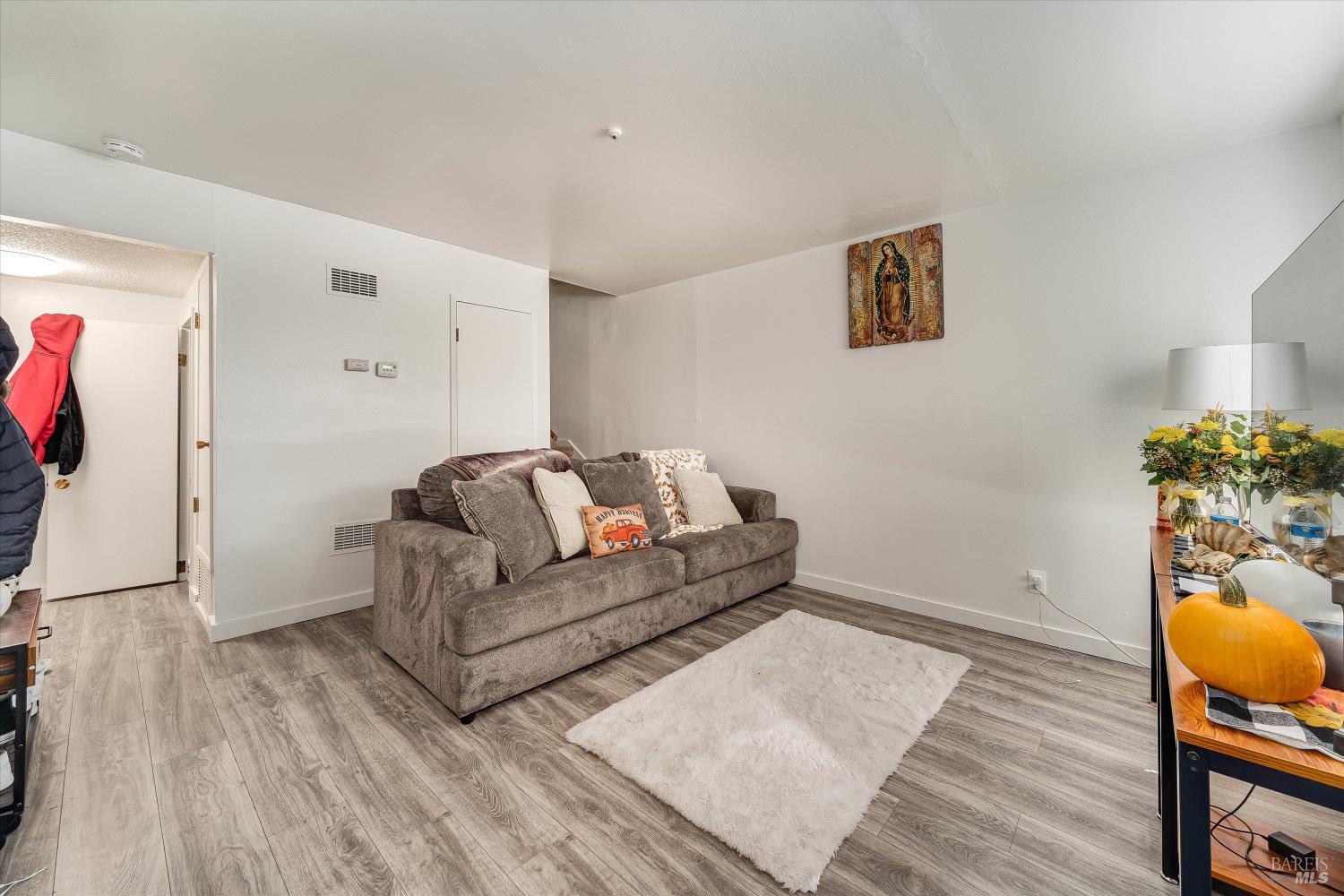 220-226 Arlen Drive Rohnert Park, CA 94928 - Photo 45 of 56 a living room with furniture and wooden floor