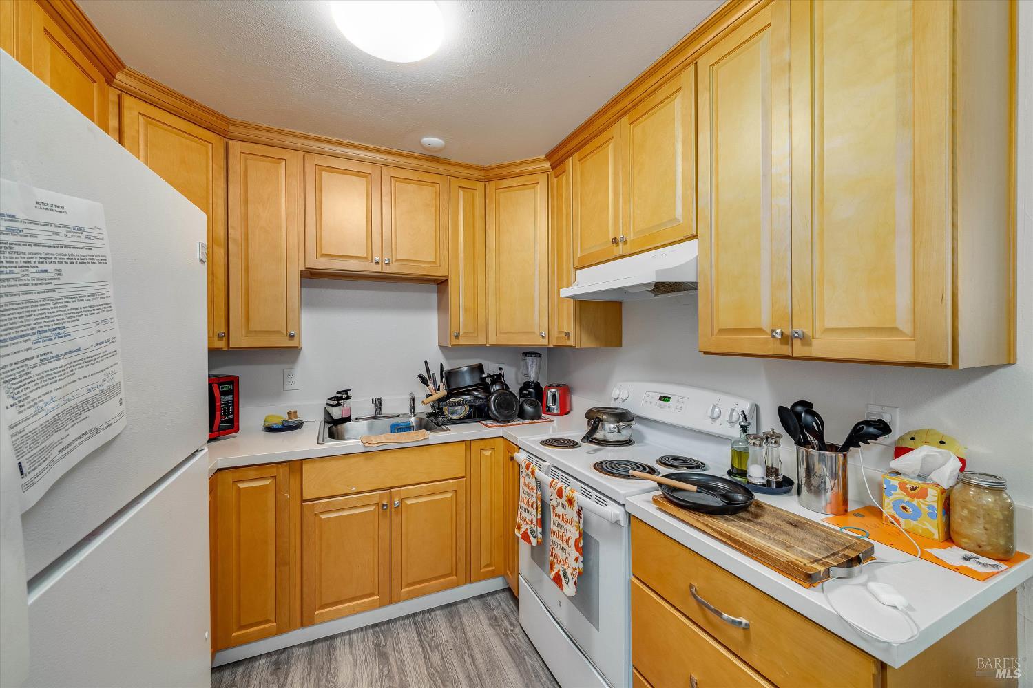 220-226 Arlen Drive Rohnert Park, CA 94928 - Photo 47 of 56 a kitchen with stainless steel appliances a sink a stove and cabinets
